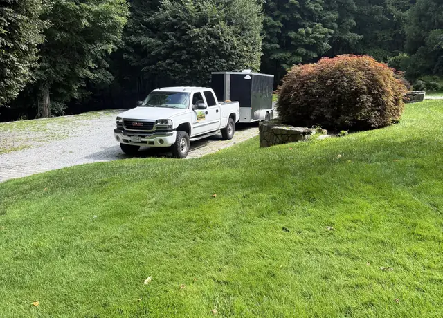 Vanguard Property Defense truck and trailer parked at a customer property